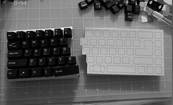 early prototype of split keyboard made out of cardboard